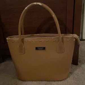 Kate Spade light brown purse. Slight wear on handles, otherwise spotless